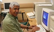 Photo of a man at a computer